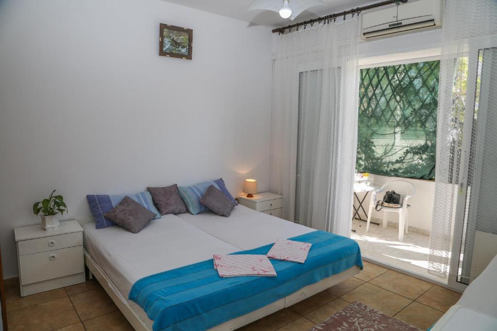Postel nebo postele na pokoji v ubytování Apartments Butkovic