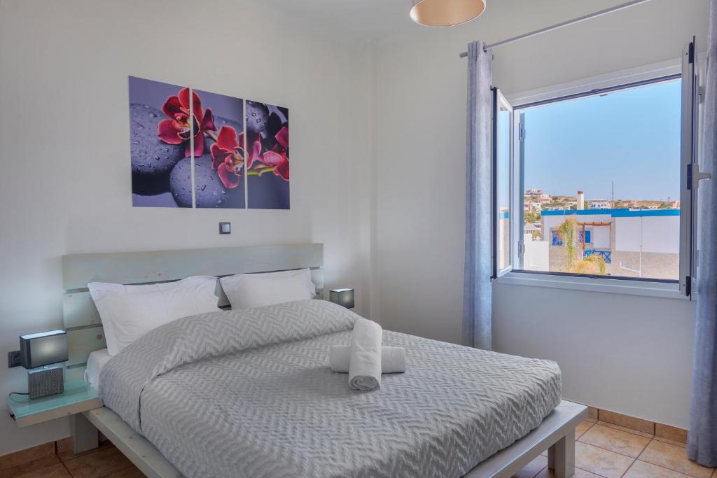 Rúm í herbergi á Aegean Paradiso Vacation Club - "Adults Only"