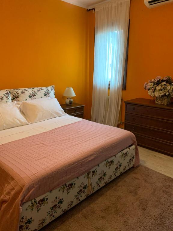 Säng eller sängar i ett rum på Casa Serenella