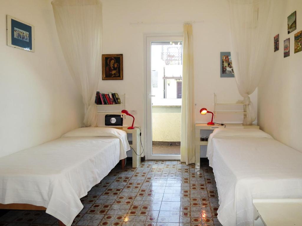 Posteľ alebo postele v izbe v ubytovaní Apartment Algamarina by Interhome