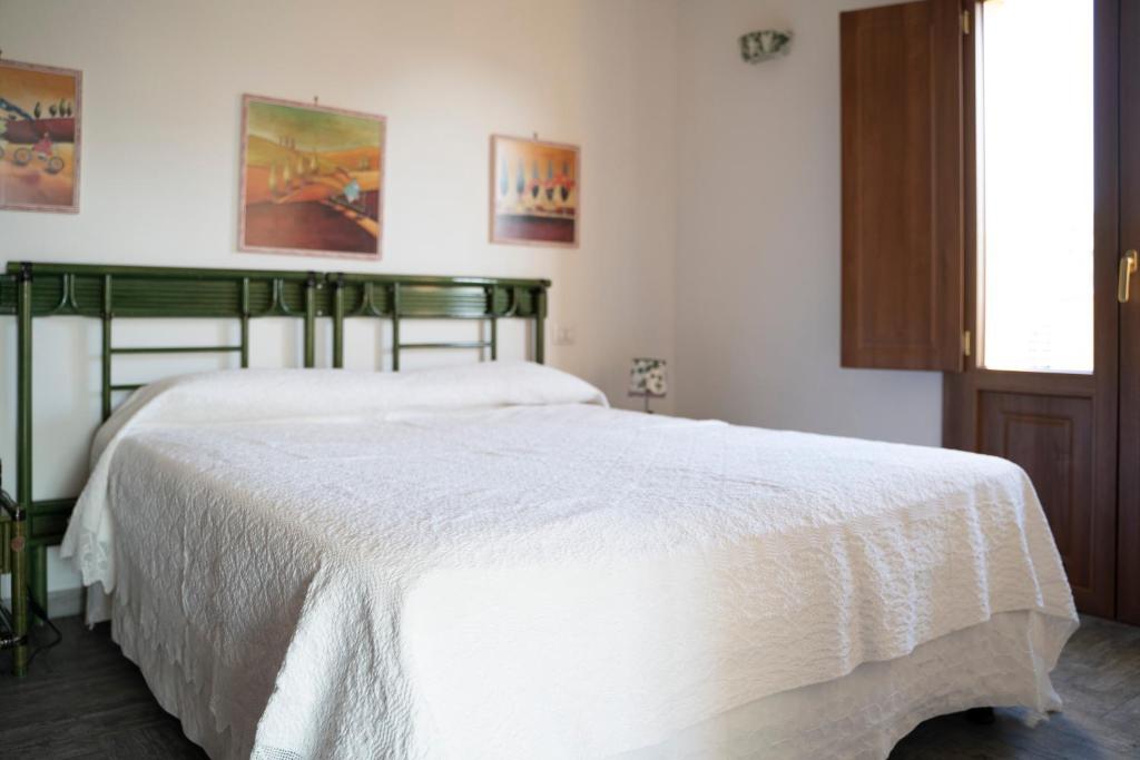 Кровать или кровати в номере Appartamento Luelen