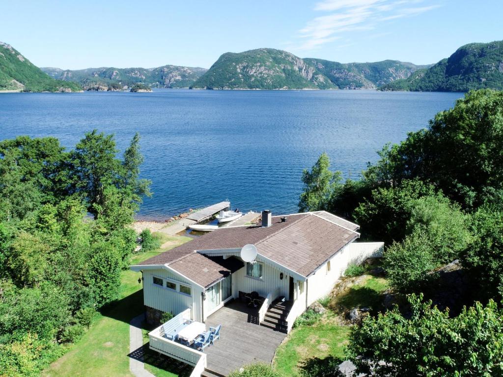 an aerial view of a house on the shore of a lake at Holiday Home Åptafjorden - SOW684 by Interhome in Farsund