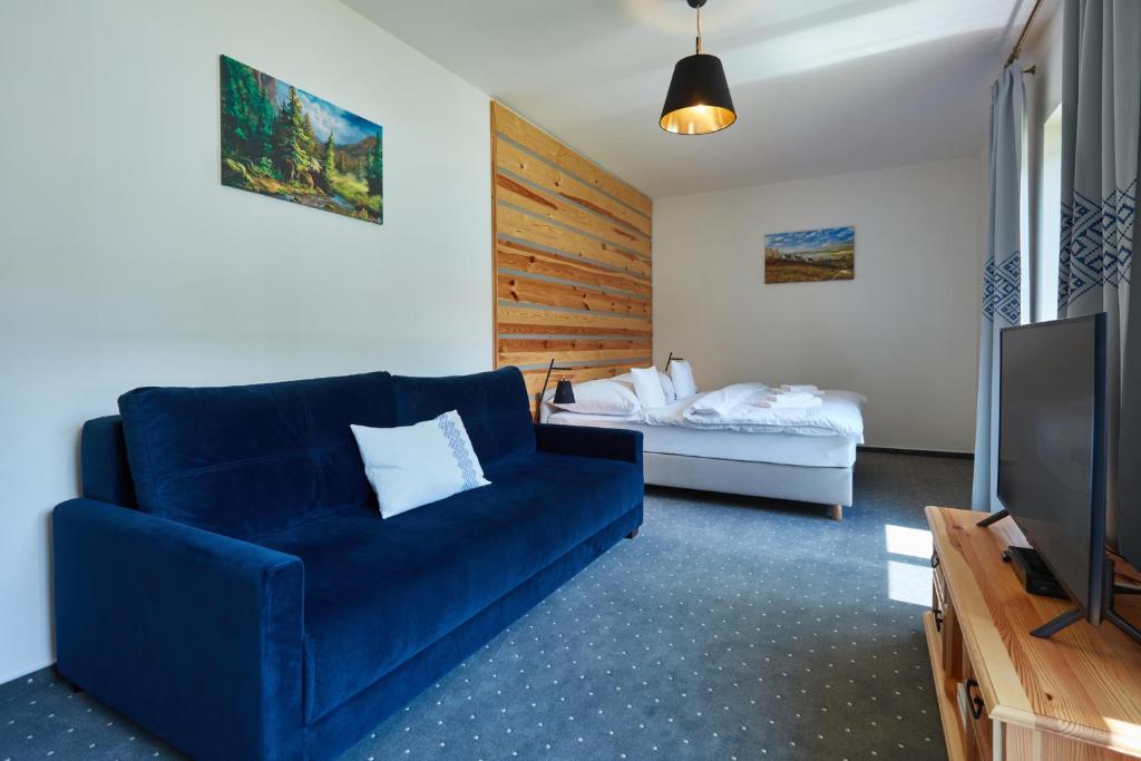 TV a/nebo společenská místnost v ubytování Rezort Gothal Apartmány a Penzióny