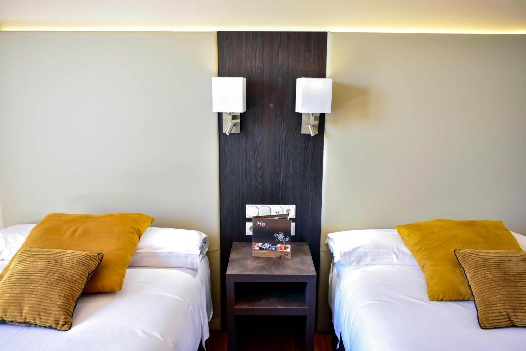 Postel nebo postele na pokoji v ubytování Hotel Armiñe