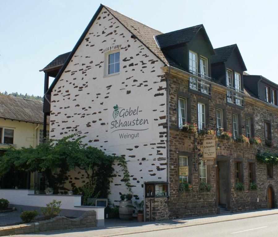 a building with a sign on the side of it at Weingut Göbel-Schausten in Ernst