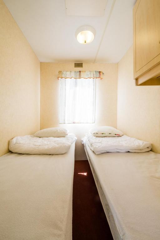 Postel nebo postele na pokoji v ubytování Rowyhills