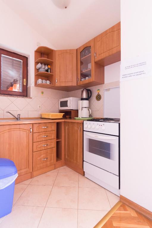 Kuchyňa alebo kuchynka v ubytovaní Apartments Casa Nada