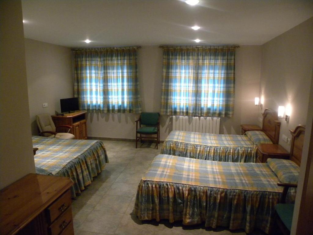Postel nebo postele na pokoji v ubytování Hotel Duque de Calabria