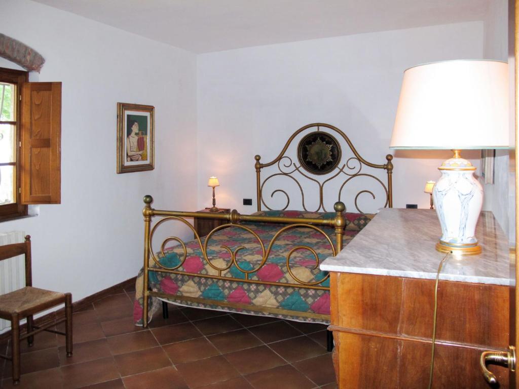 A bed or beds in a room at Holiday Home Fienile by Interhome