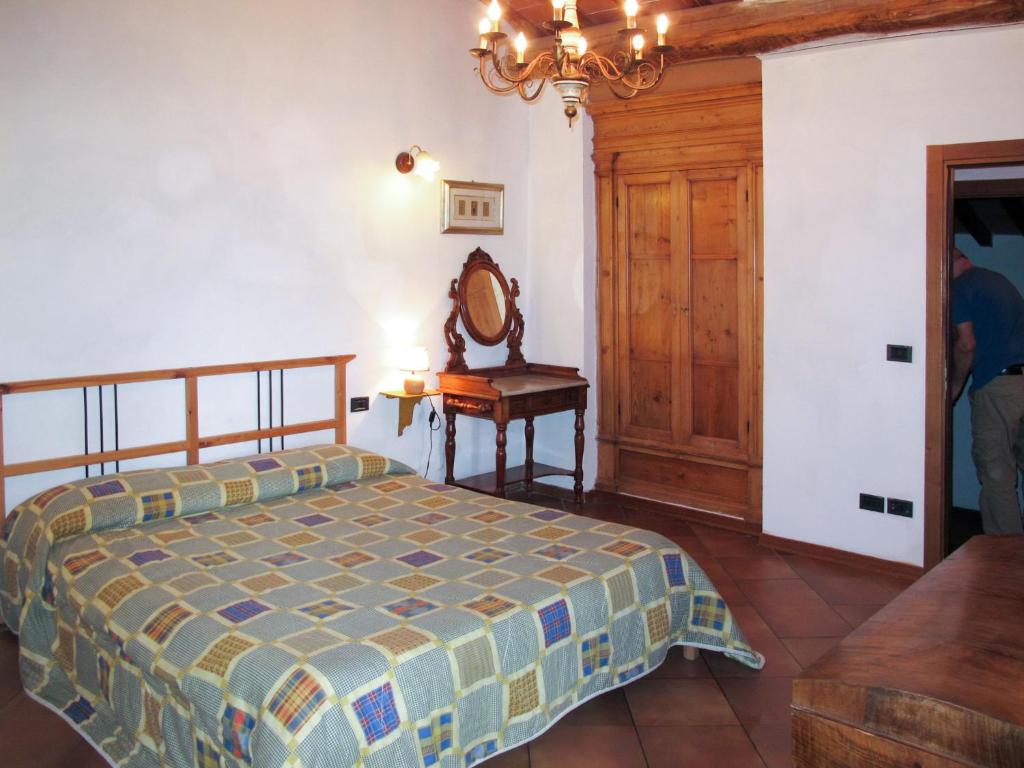 A bed or beds in a room at Holiday Home Fienile by Interhome