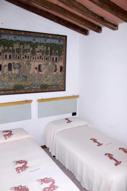 A bed or beds in a room at Holiday Home Fienile by Interhome