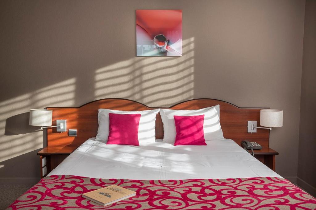 Postel nebo postele na pokoji v ubytování Hotel Les Mésanges