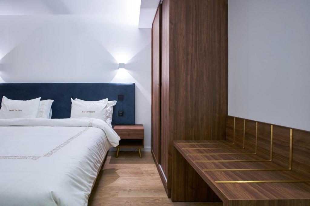 Postel nebo postele na pokoji v ubytování Hotel Moutados