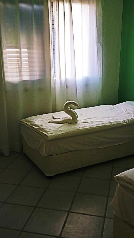 Postel nebo postele na pokoji v ubytování H&O Best Apt In Paphos!