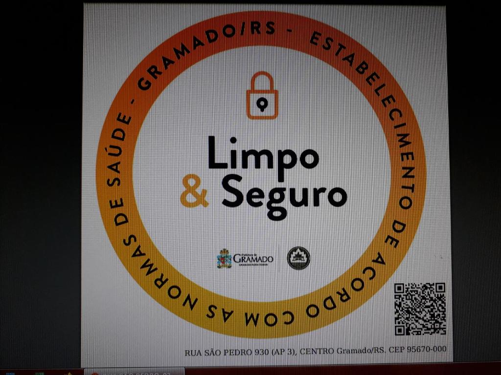 a sign for the livenop and septopro company at Novo Aconchego in Gramado
