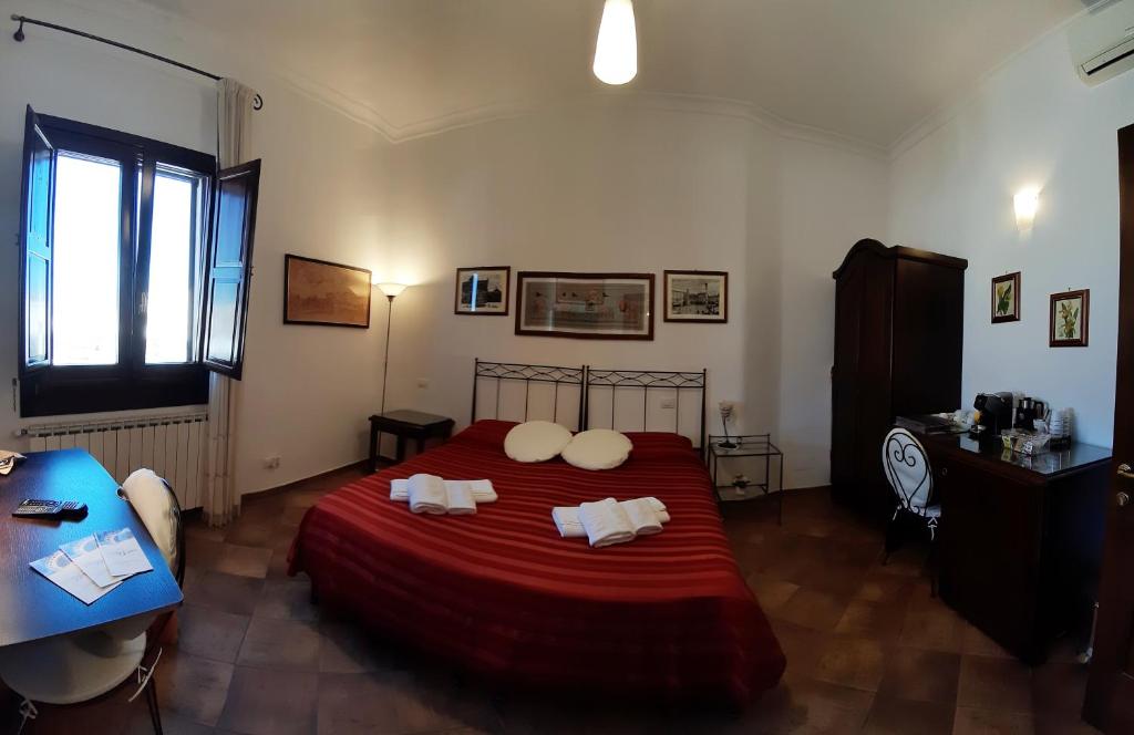 Postel nebo postele na pokoji v ubytování B&B Corte Barocca
