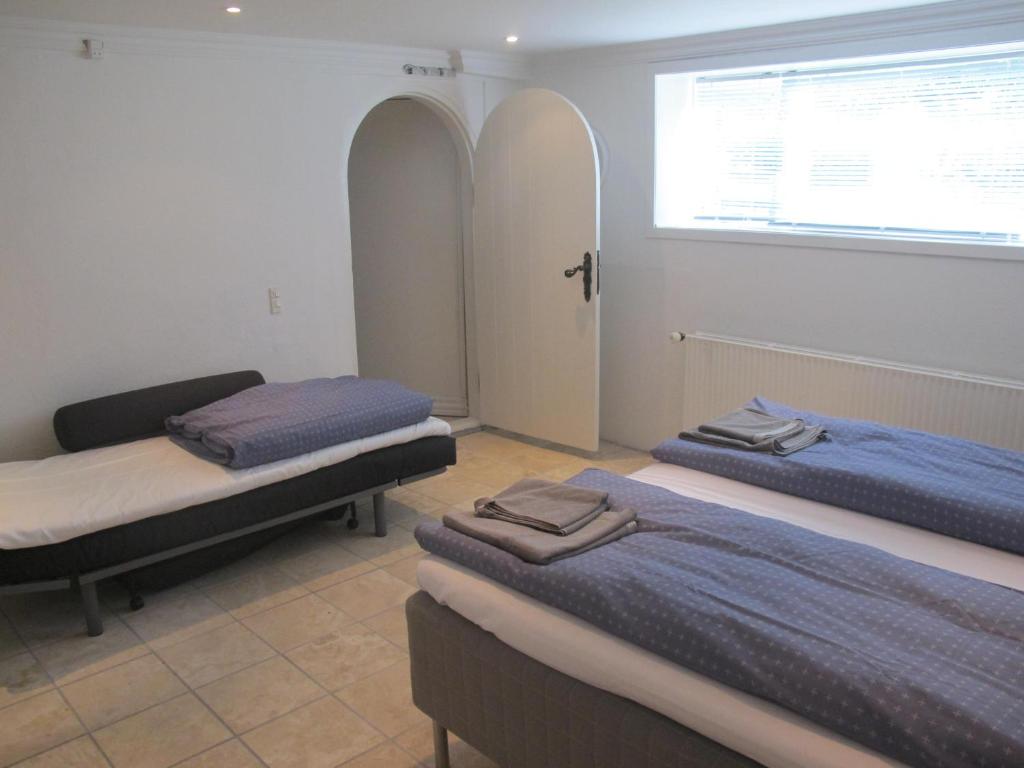 A bed or beds in a room at Guesthouse Sharon Aarhus