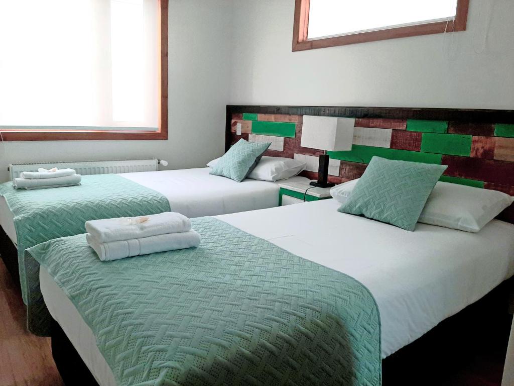 Postel nebo postele na pokoji v ubytování Hostal Buenavista Patagonia