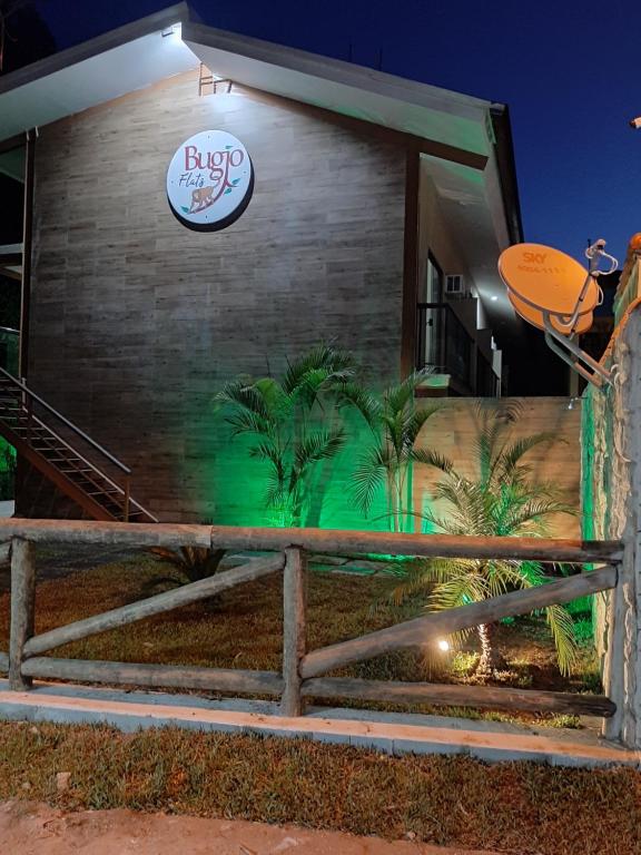 a building with a sign on the side of it at Bugio Flats in Abraão