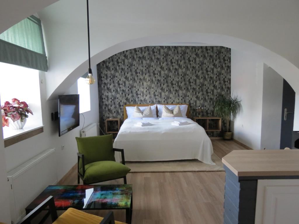 Postel nebo postele na pokoji v ubytování Apartmán Pod Synagogou