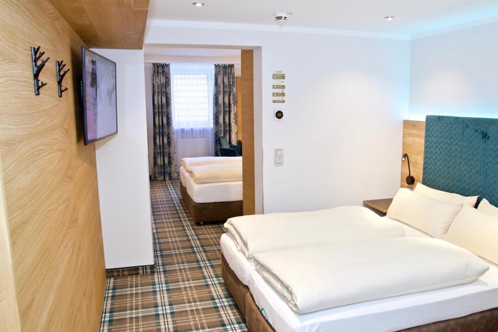 Postel nebo postele na pokoji v ubytování Hotel Zur Post