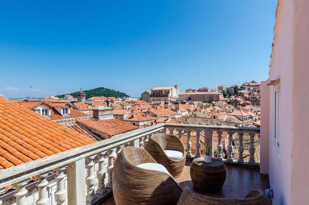 a balcony with a view of a city at Villa Palo Alto in Dubrovnik