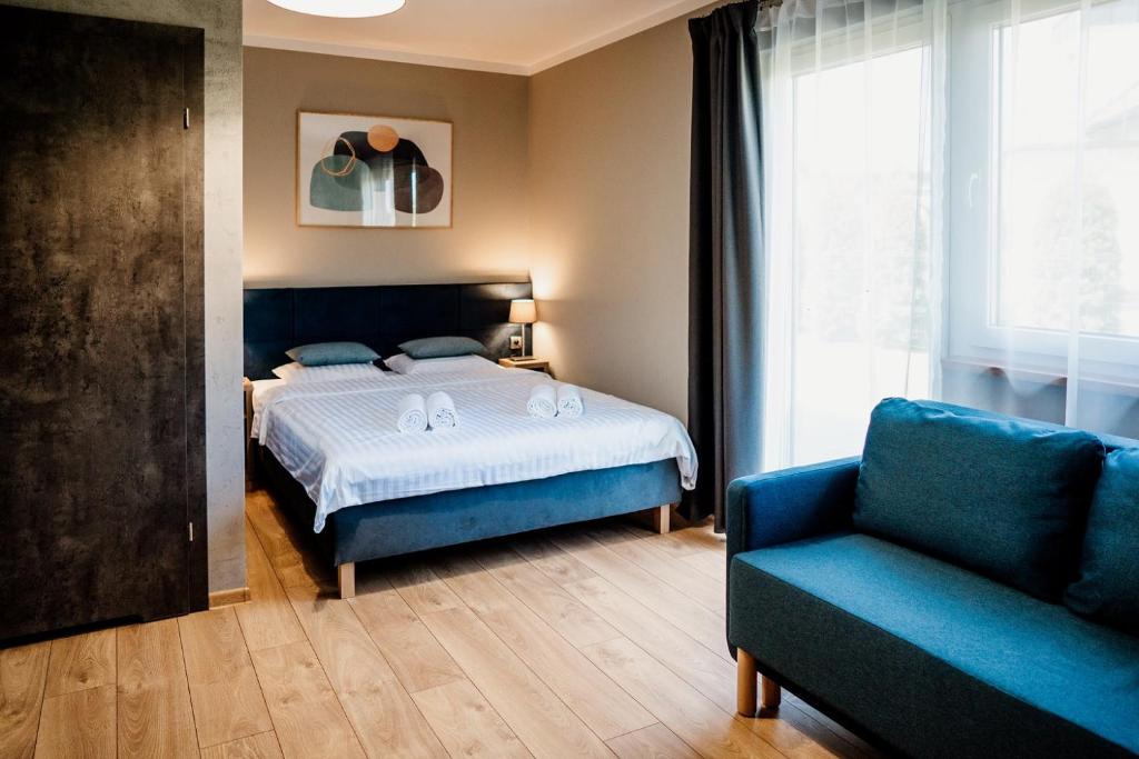 Posteľ alebo postele v izbe v ubytovaní Róża Rooms