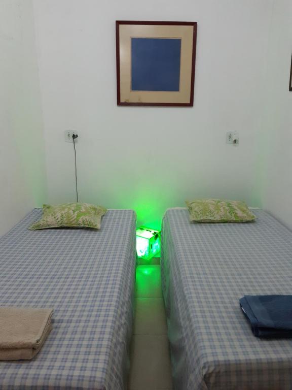 Katil atau katil-katil dalam bilik di Kitnet Aconchegante Em Benfica