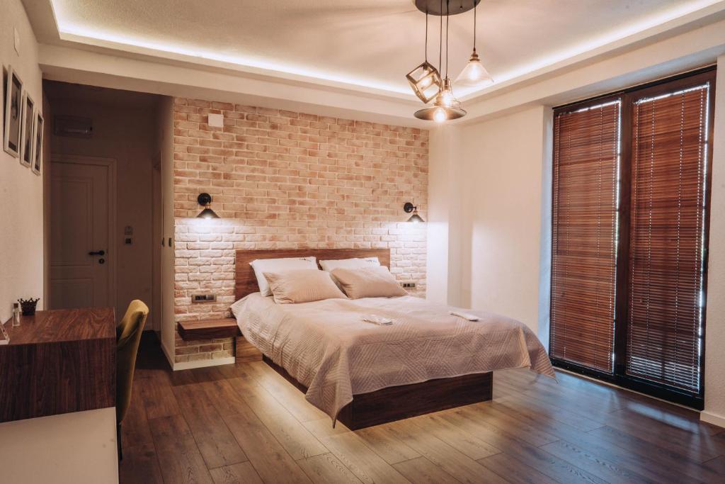 Cama ou camas em um quarto em Villa Amfora