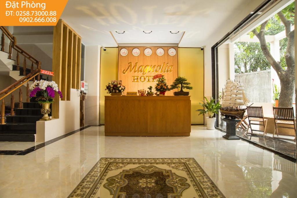a lobby of a hotel with a reception desk at Magnolia Hotel Cam Ranh in Cam Ranh