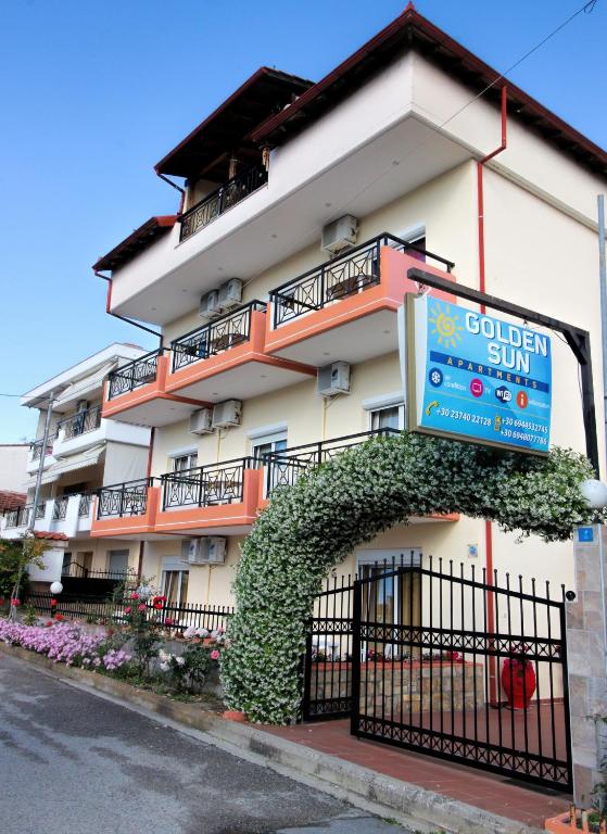 a building with a sign for a hotel at GOLDEN SUN STUDIOS in Kallithea Halkidikis
