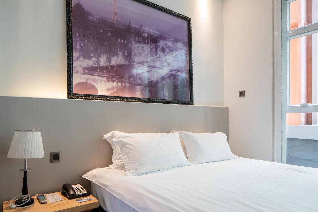 Postel nebo postele na pokoji v ubytování Wifi Boutique Hotel