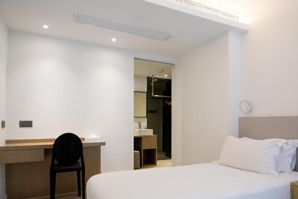 Postel nebo postele na pokoji v ubytování Wifi Boutique Hotel