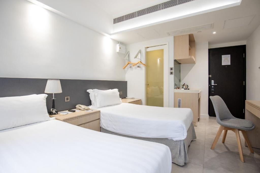 Postel nebo postele na pokoji v ubytování Wifi Boutique Hotel