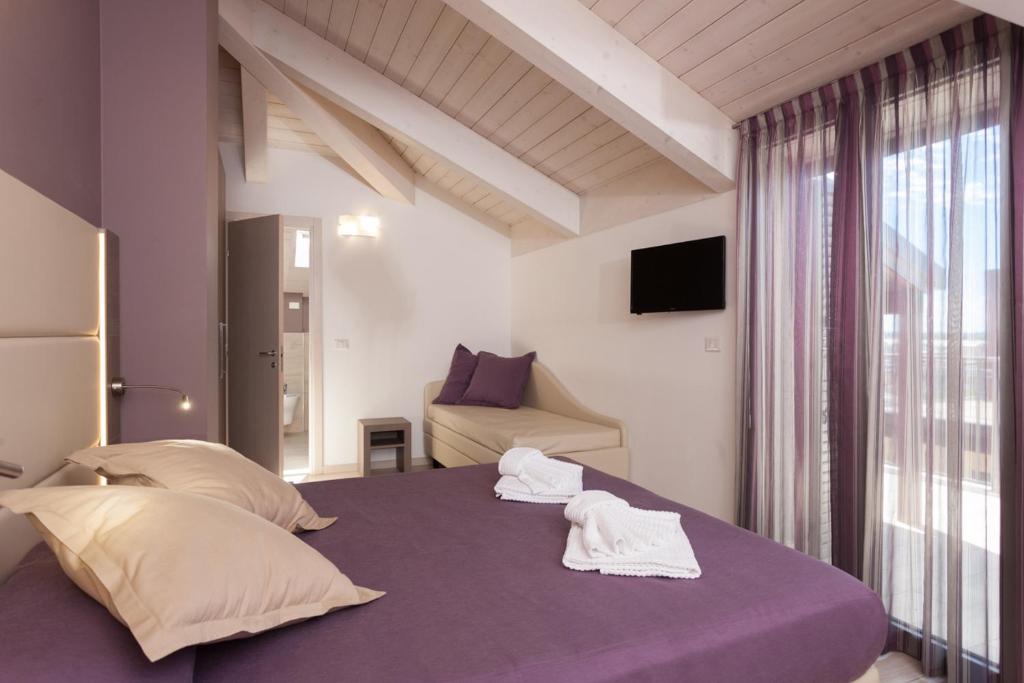 Postel nebo postele na pokoji v ubytování Hotel Gioia