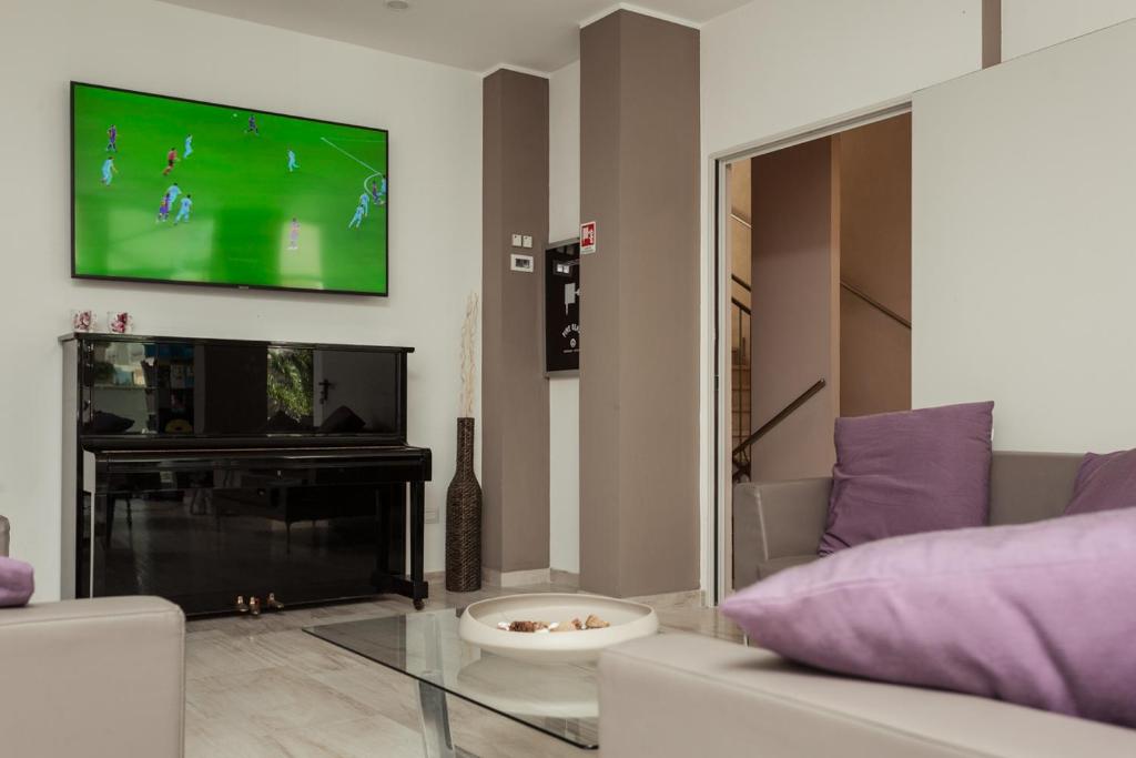 TV a/nebo společenská místnost v ubytování Hotel Gioia