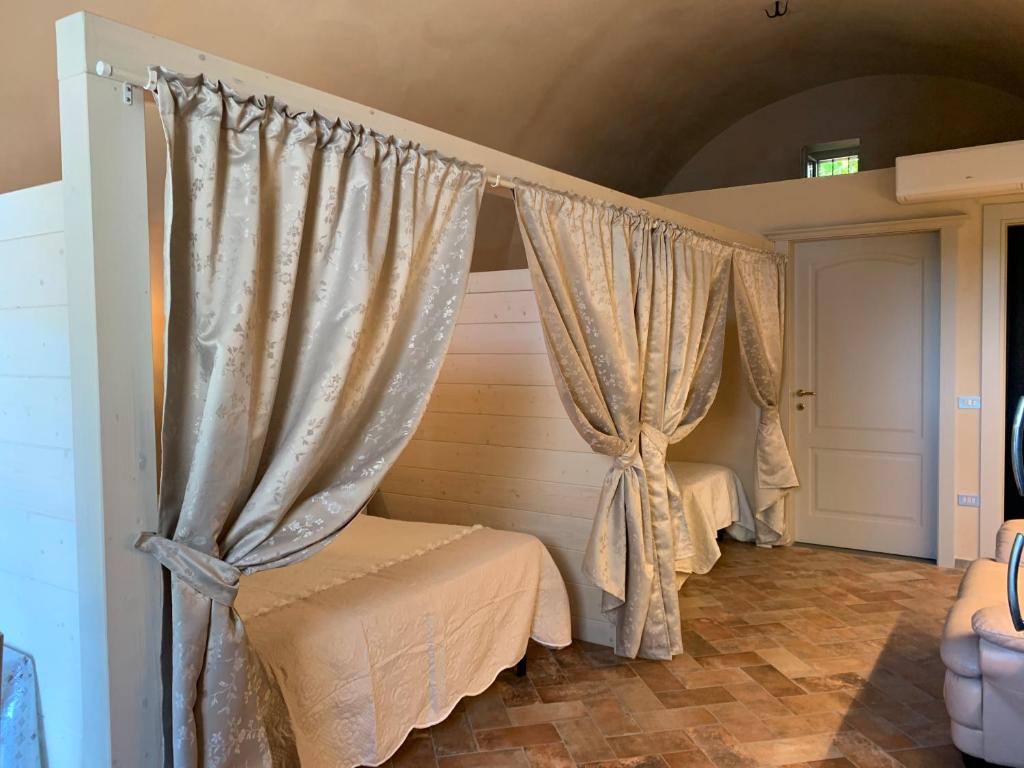 Postel nebo postele na pokoji v ubytování Agriturismo Pratofranco