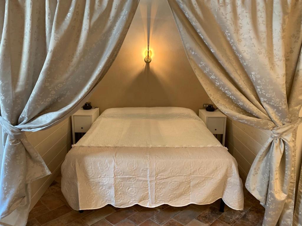 Postel nebo postele na pokoji v ubytování Agriturismo Pratofranco