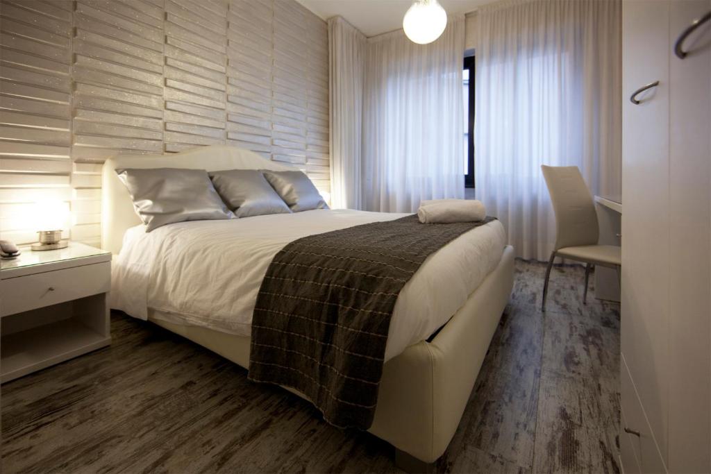 Postel nebo postele na pokoji v ubytování Piccolo Hotel Allamano
