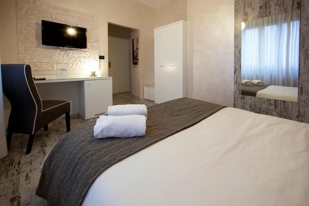 Postel nebo postele na pokoji v ubytování Piccolo Hotel Allamano
