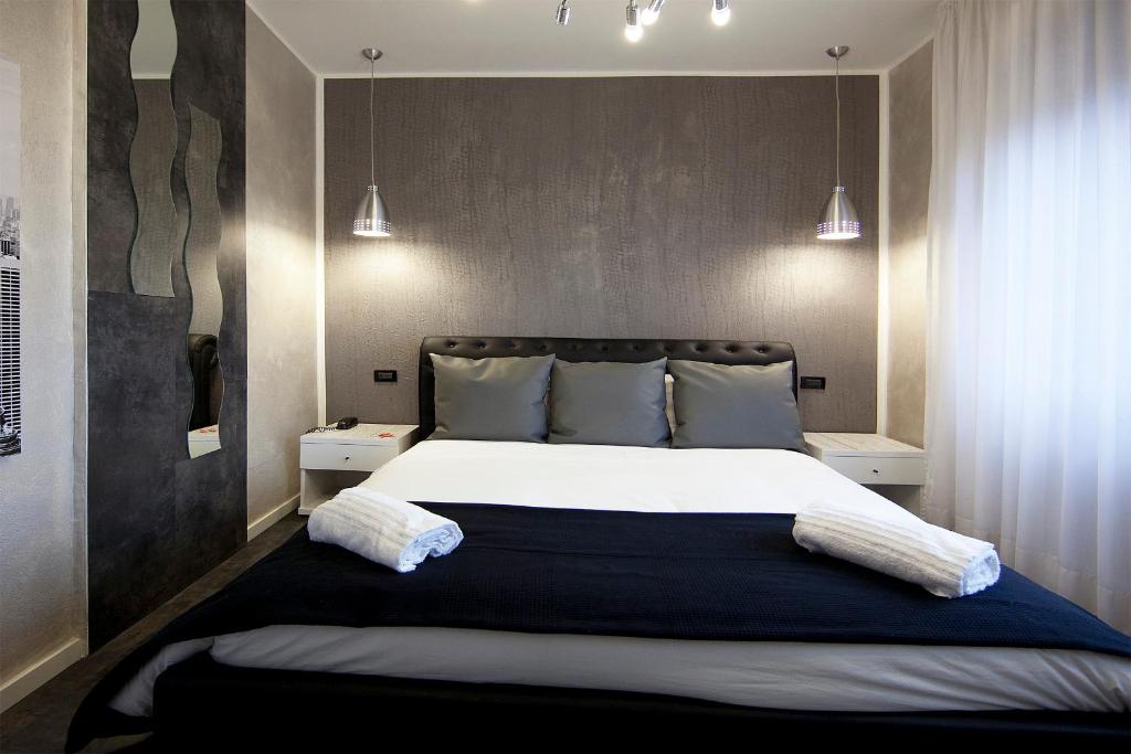 Postel nebo postele na pokoji v ubytování Piccolo Hotel Allamano