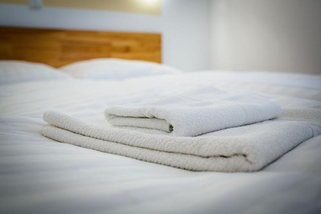 Postel nebo postele na pokoji v ubytování Guesthouse Halilagic