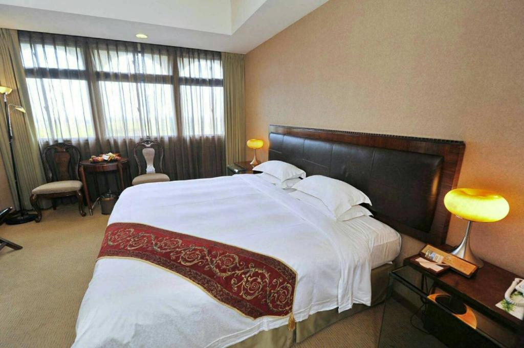 Postel nebo postele na pokoji v ubytování Resort One Hotel