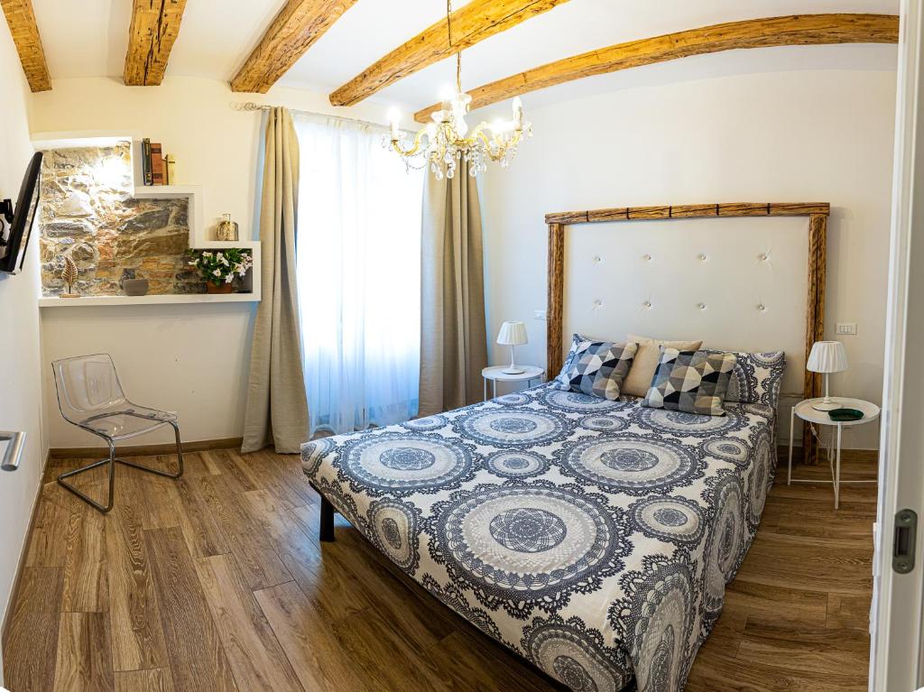 Ένα ή περισσότερα κρεβάτια σε δωμάτιο στο la Maison de Trieste Suite garage