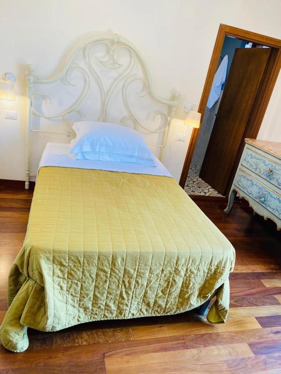 A bed or beds in a room at Agriturismo Le Anfore
