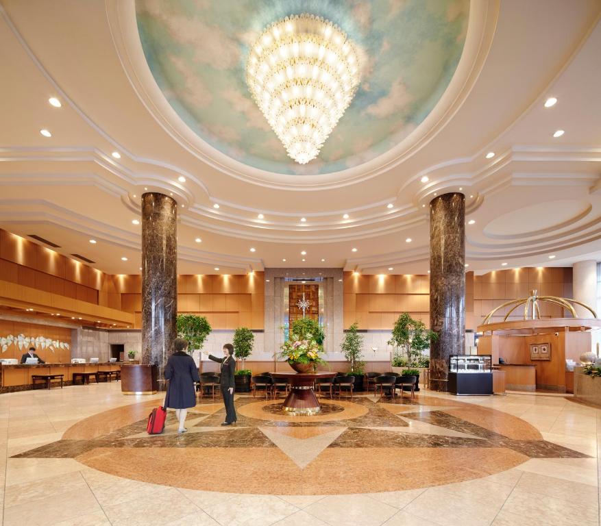 a lobby of a hotel with a large ceiling at ANA Crowne Plaza Toyama, an IHG Hotel in Toyama