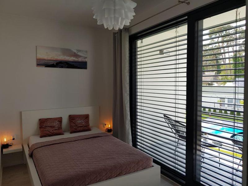 Posteľ alebo postele v izbe v ubytovaní Aprum Apartments 12C