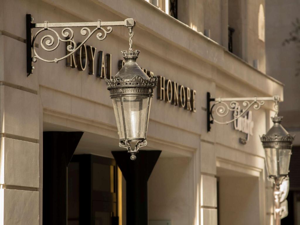 a street light in front of a building at Hotel Royal Saint Honore Paris Louvre in Paris