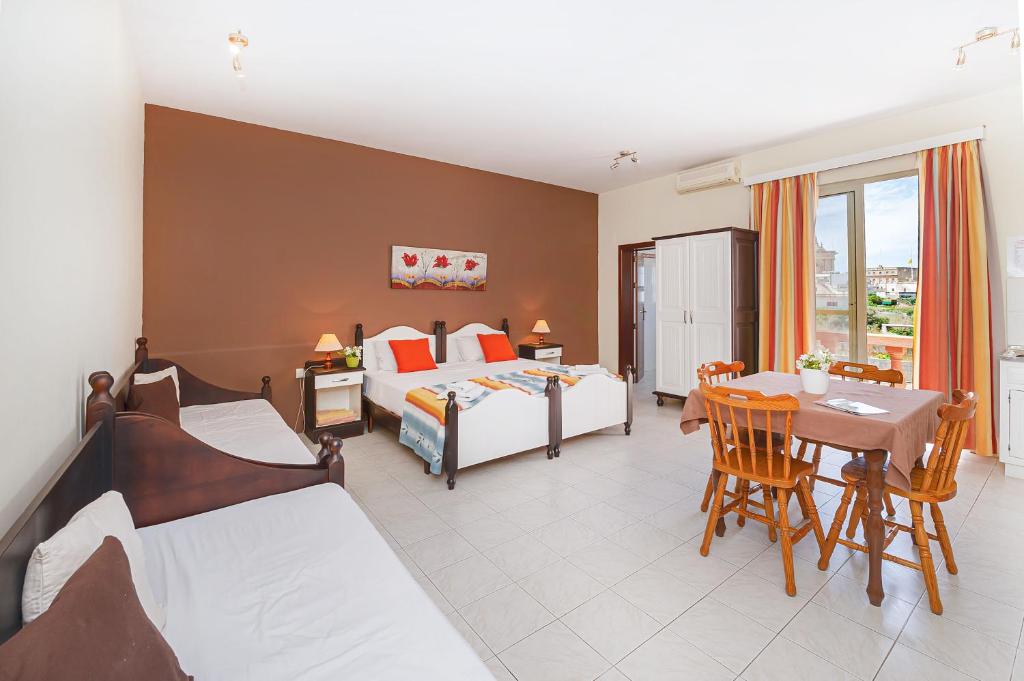 Voodi või voodid majutusasutuse Mariblu Hotel toas