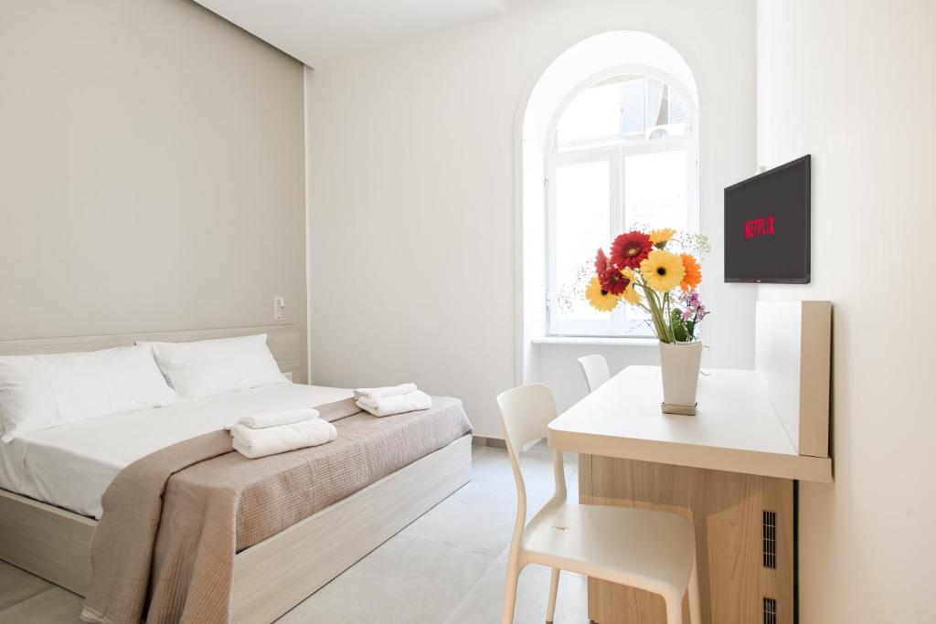 Posteľ alebo postele v izbe v ubytovaní Lux Caracciolo